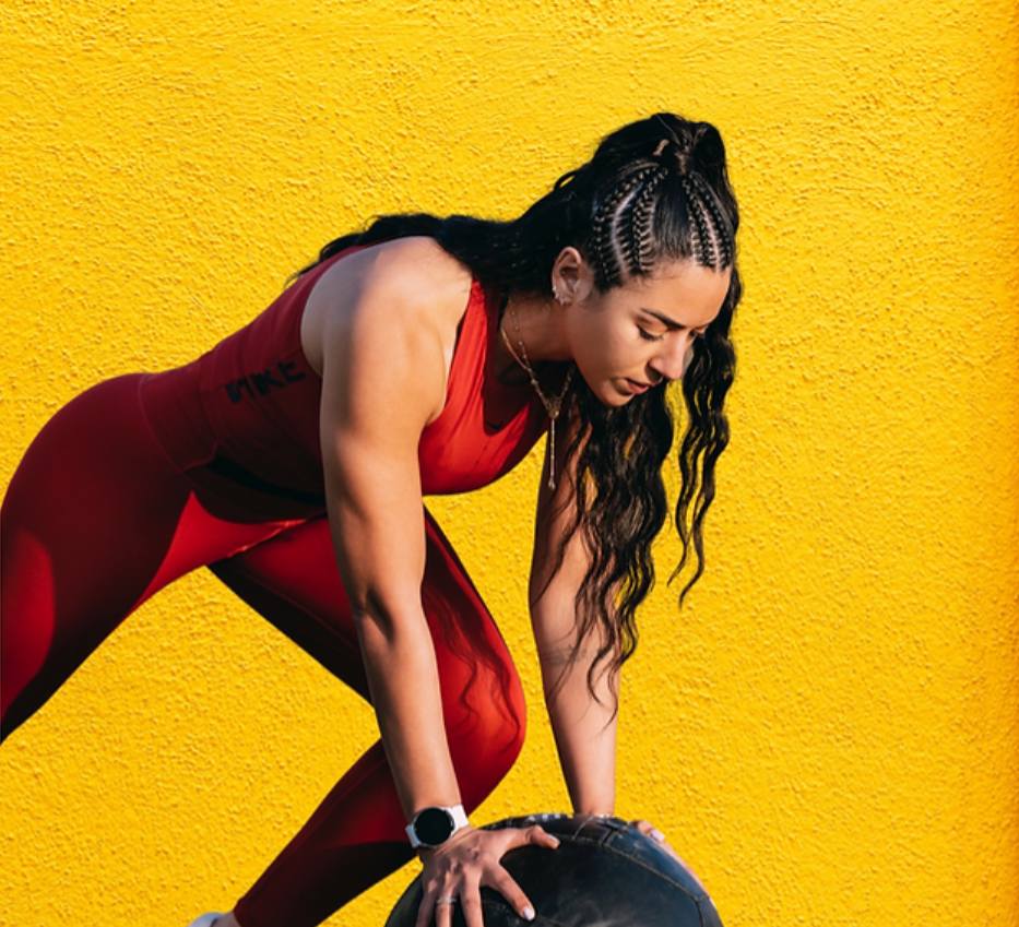 An athletic lady doing leg exercises