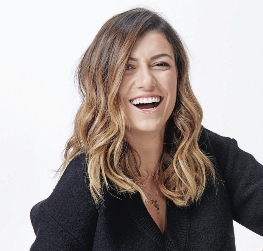 Portrait of a wholesome person smiling in a studio setting